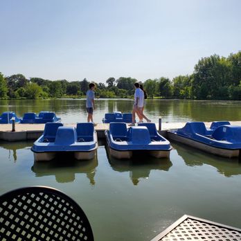 The Boathouse at Forest Park - two people standing on the dock - New American Near Me - Saint Louis, Missouri The Boathouse at Forest Park - two people standing on the dock - New American Near Me - Saint Louis, Missouri