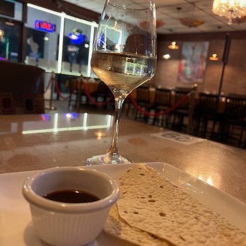 Taj Grill - papadum with dipping sauce and white wine - Indian Near Me - Vallejo, California Taj Grill - papadum with dipping sauce and white wine - Indian Near Me - Vallejo, California