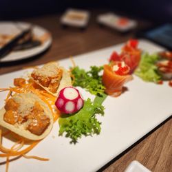 Wind Japanese and Thai - Chipotle salmon on a Pringle, salmon roses, then eel pieces