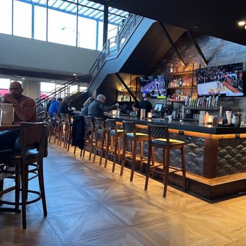 BRU Burger Bar-Westerville - Bar area with stairs going to second floor. - Burgers Near Me - Westerville, Ohio