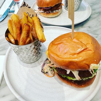 Mildreds - nashville hot chick'n with fries and bbq pulled pok with fries - Vegan Near Me - London, XGL Mildreds - nashville hot chick'n with fries and bbq pulled pok with fries - Vegan Near Me - London, XGL