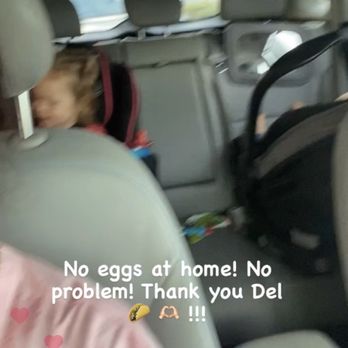 Del Taco - Kids in the back seat of the del Taco drive thru, getting breakfast egg and bacon roller - The image shows the interior of a car with children seated in car seats. The photo is slightly blurry and captures the back seats and part of the front seats. Overlaid text indicates no eggs at home, a thank you message to Del Taco, and the time 7:20 AM. The scene suggests a family car trip or outing, with a focus on children and breakfast plans. - Mexican Near Me - Mesa, Arizona