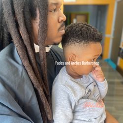 Fades & Arches Barber Shop - Little guy dis great job getting haircut at Barbershop