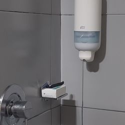 Ibis Hotel - Communal soap dispenser in the shower