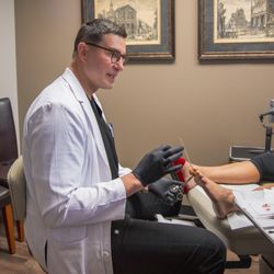 Doctor's - Dr. Jenson treating a podiatry patient.