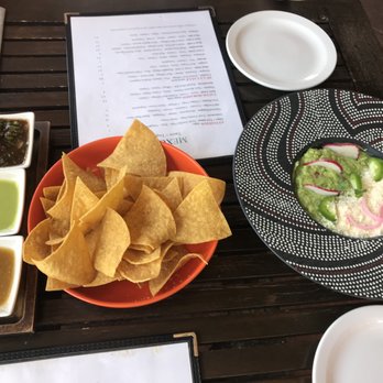 Mexcal - Chips and Guac! Comes with mild/hot sauces too! - Mexican Near Me - Reno, Nevada Mexcal - Chips and Guac! Comes with mild/hot sauces too! - Mexican Near Me - Reno, Nevada
