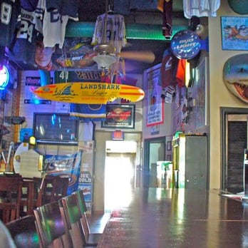 Sharkeez - a surfboard hanging from the ceiling - Pubs Near Me - Lees Summit, Missouri