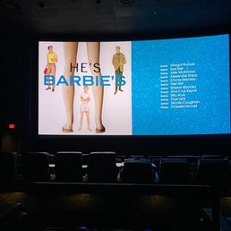 a large screen displaying a movie