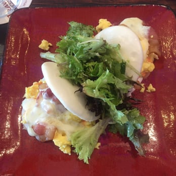 Travesias - Bacon egg and cheese on a seam bun - Latin American Near Me - Bronx, New York Travesias - Bacon egg and cheese on a seam bun - Latin American Near Me - Bronx, New York