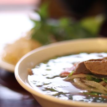 Pho Big Bowl - a bowl of soup on a table - Vietnamese Near Me - Watauga, Texas Pho Big Bowl - a bowl of soup on a table - Vietnamese Near Me - Watauga, Texas