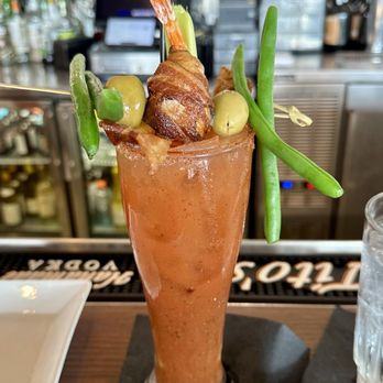 BLVD Seafood - Deluxe Bloody Mary with a bacon wrapped cheese stuffed shrimp and bacon slice, each prepared when the drink was ordered, so fresh and warm. - New American Near Me - Galveston, Texas