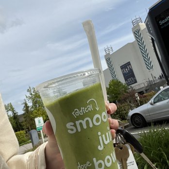 Jamba - a person holding a cup of green smoothie - Juice Bars & Smoothies Near Me - Lynnwood, Washington
