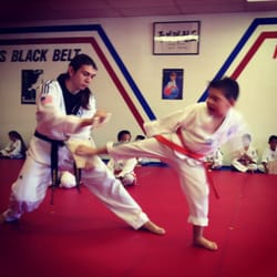 High-Kick Tae Kwon - My son testing for his purple belt, working with Instructor Bryan.