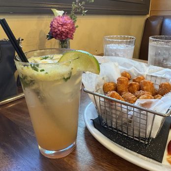 Plank Craft Kitchen & Bar - Tater tot appetizer and a mojito - American Near Me - Folsom, California Plank Craft Kitchen & Bar - Tater tot appetizer and a mojito - American Near Me - Folsom, California