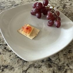 Harmons Neighborhood Grocer - Crackers, Gouda, jalapeño jelly, and some unrelated grapes.
