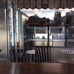 Nimbin Bakery - Seating inside and out, outside join the friendly rooster.