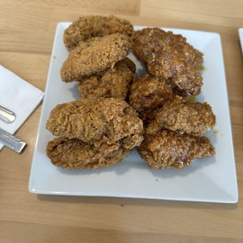 92 Chicken - Lemon pepper on the left and honey garlic on the right - Chicken Wings Near Me - Sugar Land, Texas
