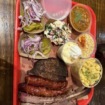 Terry Black's Barbecue - Beef rib, brisket, jalapeño cheese sausage, Mac n cheese, cream corn, banana pudding - Barbeque Near Me - Austin, Texas Terry Black's Barbecue - Beef rib, brisket, jalapeño cheese sausage, Mac n cheese, cream corn, banana pudding - Barbeque Near Me - Austin, Texas