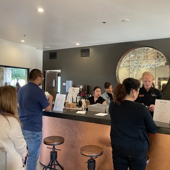 Rava Wines - a group of people at a bar - Wine Tasting Room Near Me - Paso Robles, California
