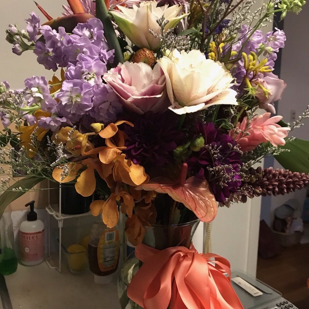 Beautiful custom bouquet with tropical flowers mixed with other fragrant flowers. Nice sturdy vase, too. Beautiful custom bouquet with tropical flowers mixed with other fragrant flowers. Nice sturdy vase, too.