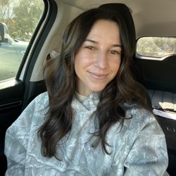 The gloss and haircut package revived the dimension and shine in Megan's color making her hair wedding ready
