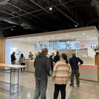 IJ Sushi Burrito - a group of people in a restaurant - Poke Near Me - Shoreline, Washington