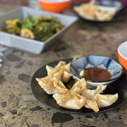 Tai Lai Shun - Cheese wonton and cucumber sides.
