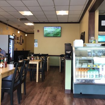 Garlic 'n Lemons - Dining area to the side of front counter. Hallway in back leads to restrooms. - Middle Eastern Near Me - Boston, Massachusetts