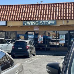 Exterior outside entrance of Wingstop - View from parking lot - Tarzana, California Exterior outside entrance of Wingstop - View from parking lot - Tarzana, California