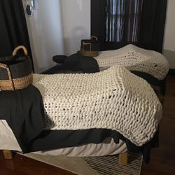 Platinum Bliss Massage - Elax on our plush massage tables with hand-knit blankets in a minimalist room designed for ultimate comfort and tranquility.
