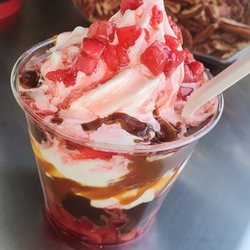 The Yo Shack - The Strawberry Cup!  The Yo Shack's Premium Vanilla Frozen Yogurt with hot Hershey's fudge, hot Hershey's Caramel & fresh strawberries!