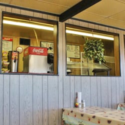 Smokehouse Bar B Q - Seating is picnic bench-style.  Very clean, always.  Behind the half-wall, there is a line of food where get your barbeque and sides.