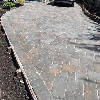 JJ Smith Landscape Design/Build - a car parked in the driveway - Landscaping Near Me