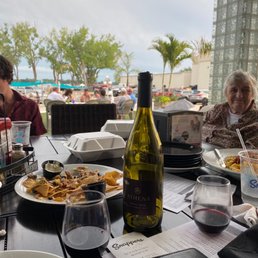 a table full of food and wine