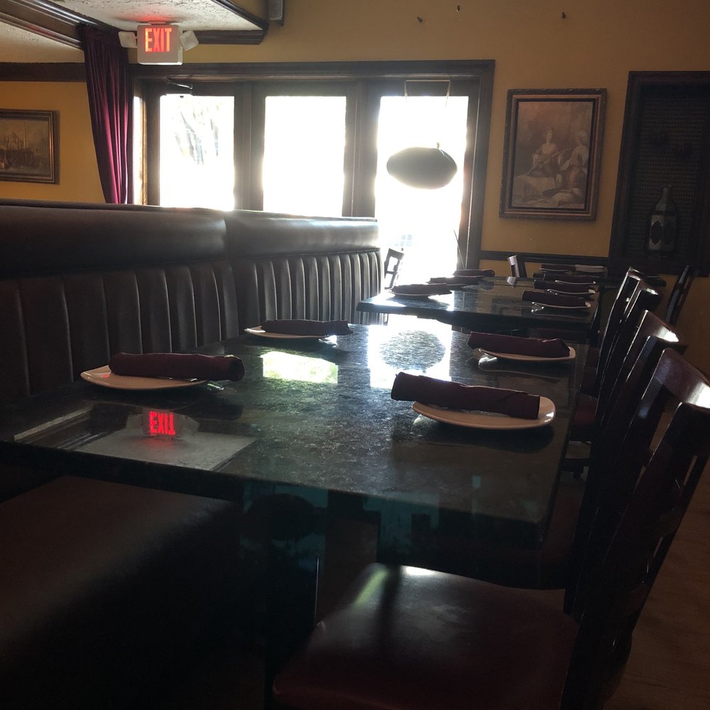 Aya Sofia - a dining room with a table and chairs - Turkish Near Me - Saint Louis, Missouri Aya Sofia - a dining room with a table and chairs - Turkish Near Me - Saint Louis, Missouri