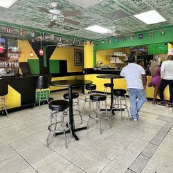 Caribbean Hot Pot Grill - Seating area and order/pick up counter.