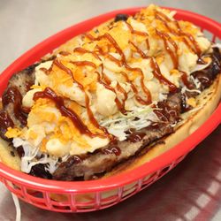 P's Picnic Brisket Sandwich: Garlic roll, Barbecue Sauce, Smoked Brisket, Shredded Cabbage, Mac & Cheese, Barbecue Chips