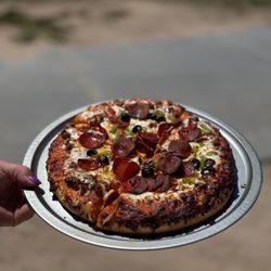 Foothills Par 3 - Grilled Supreme Pizza with Sausage, Pepperoni, Green and Red Bell Peppers, Black Olives, White Onions and Mozzarella Cheese.