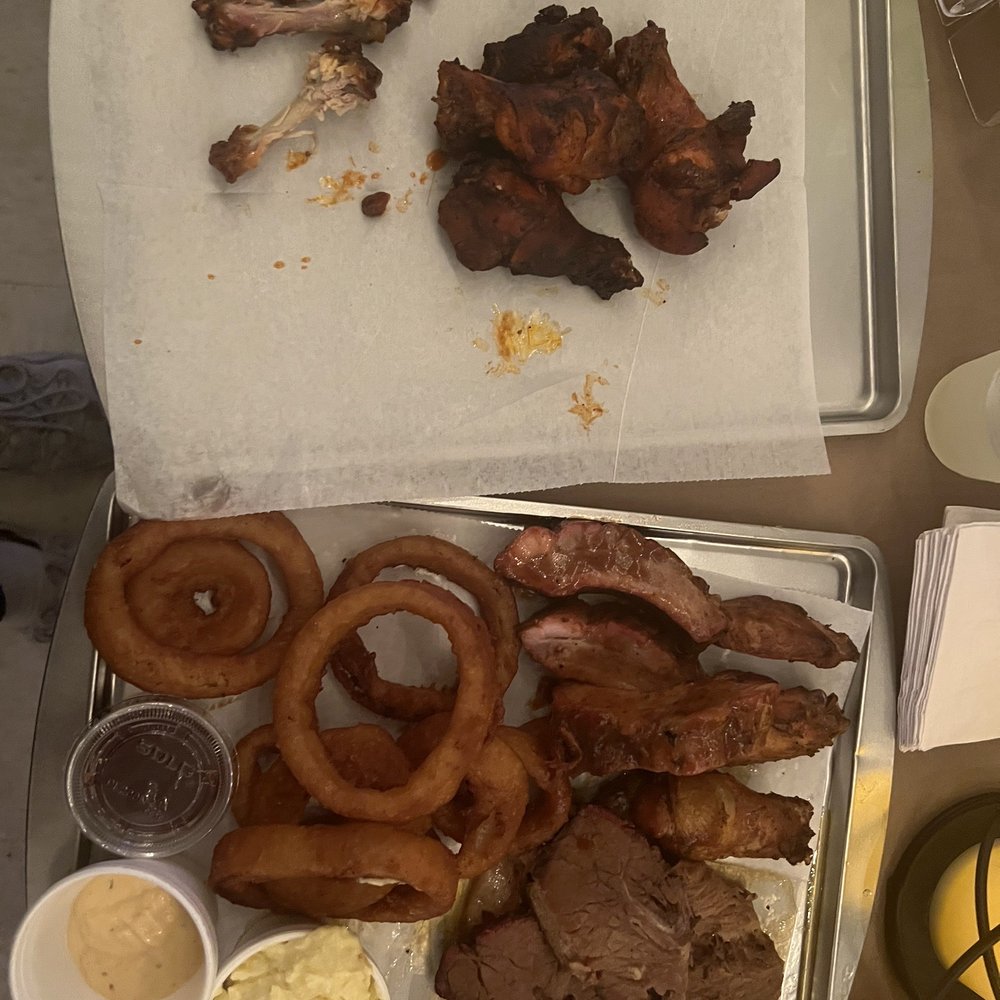 Meat platter with a side of onion rings and potato salad along with a side order of wings. Meat platter with a side of onion rings and potato salad along with a side order of wings.