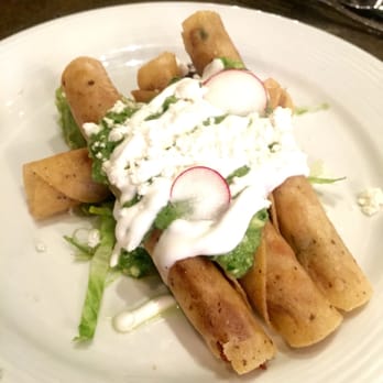Hugo's - Taquitos de Pollo rolled fried chicken tacos, guacamole, salsa verde and crema fresca - Mexican Near Me - Houston, Texas