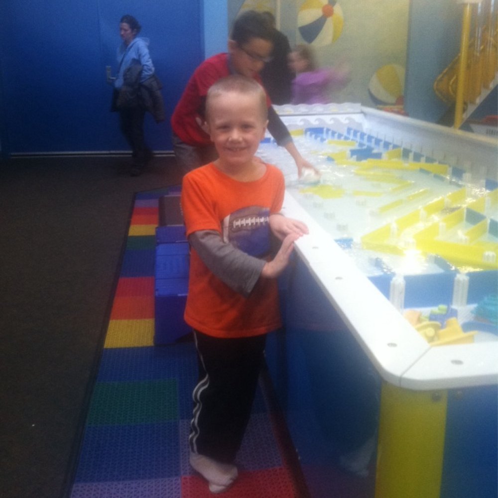 Great Lakes Children's Museum - Evan enjoying the water table! - Children's Museums Near Me - Traverse City, Michigan Great Lakes Children's Museum - Evan enjoying the water table! - Children's Museums Near Me - Traverse City, Michigan