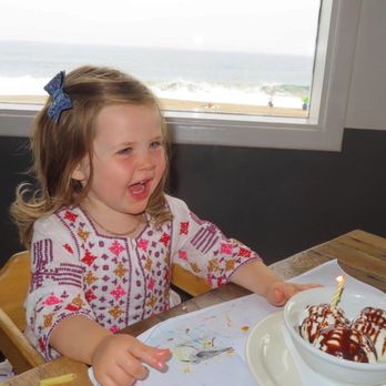 The Sunset Restaurant - Happy birthday girl and her special ice cream - New American Near Me - Malibu, California The Sunset Restaurant - Happy birthday girl and her special ice cream - New American Near Me - Malibu, California