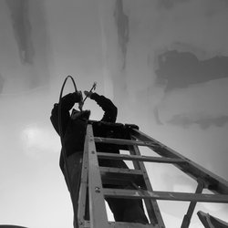 Affordable and Dependable Contracting - Our contractor, painting ceilings for a client