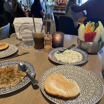 Del Mar Columbus - Baba ghanoush (left, $6), Tzatziki (middle right, $8), chilled vegetables (far right, $6). Turkish frappe drink in background. - Mediterranean Near Me - Columbus, Ohio
