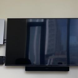 Tv Tech - Mounted TV, sound bar, gaming systems.