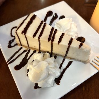 Harbor Grille - Cheesecake with chocolate sauce. This was such rich cheesecake & perfect to share - New American Near Me - Lakeside, Montana Harbor Grille - Cheesecake with chocolate sauce. This was such rich cheesecake & perfect to share - New American Near Me - Lakeside, Montana