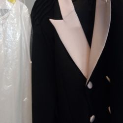 The Best Price Drycleaning - Jacket collar, pockets and buttons are PINK.  Look at white dress next to jacket, clearly see the cleaners washed jacket with something RED.