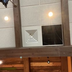 Uncle Julio's - Missing ceiling tile directly above the bar