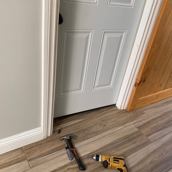 Laguna Niguel Locksmith Service - Lock didn't align with hole so he had a drill and is fixing the issue - Keys & Locksmiths Near Me