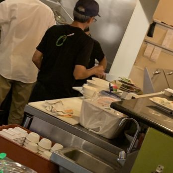 Saigon Bistro - Plates of food being prepared stacked on top of other plates of food! And all three of them aren't wearing gloves. - Vietnamese Near Me - Lakeland, Florida Saigon Bistro - Plates of food being prepared stacked on top of other plates of food! And all three of them aren't wearing gloves. - Vietnamese Near Me - Lakeland, Florida